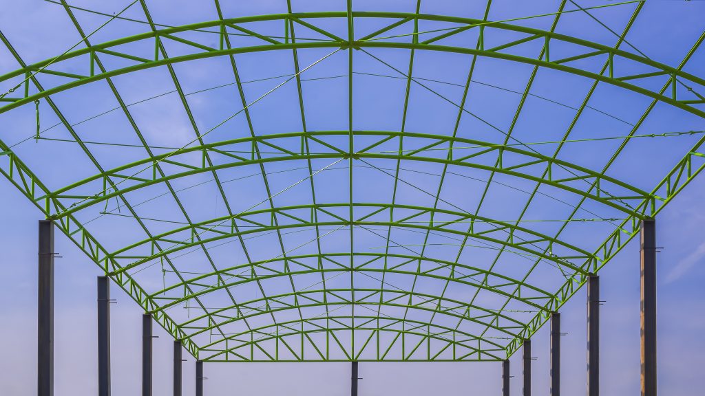 green metal roof structure of warehouse building a 2023 11 27 05 31 30 utc